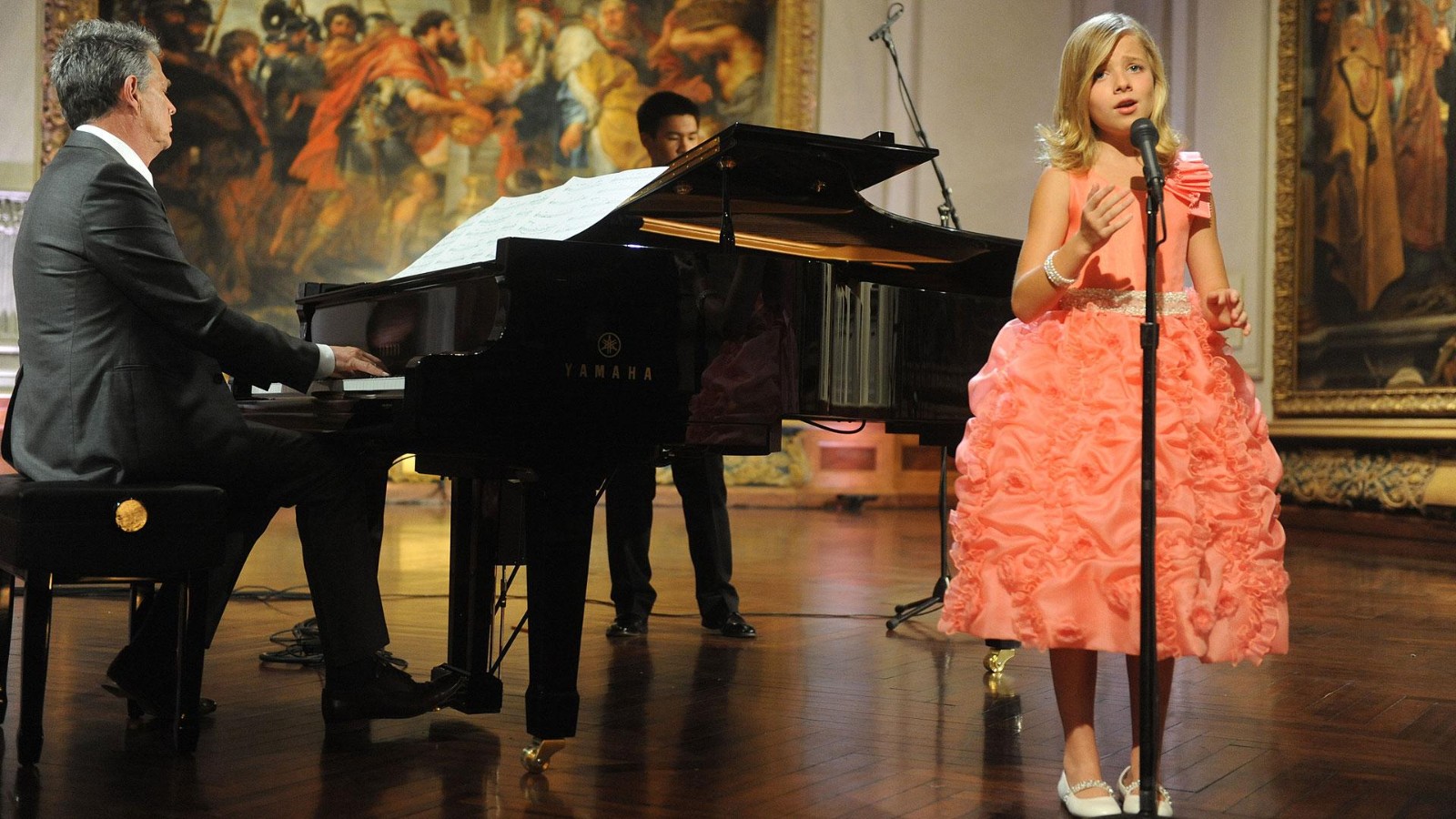 Jackie Evancho singing in concert